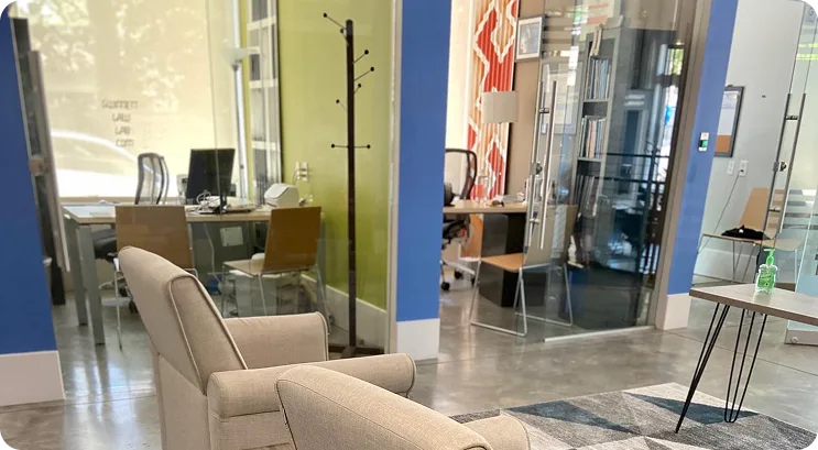 Lounge seating and glass-walled offices