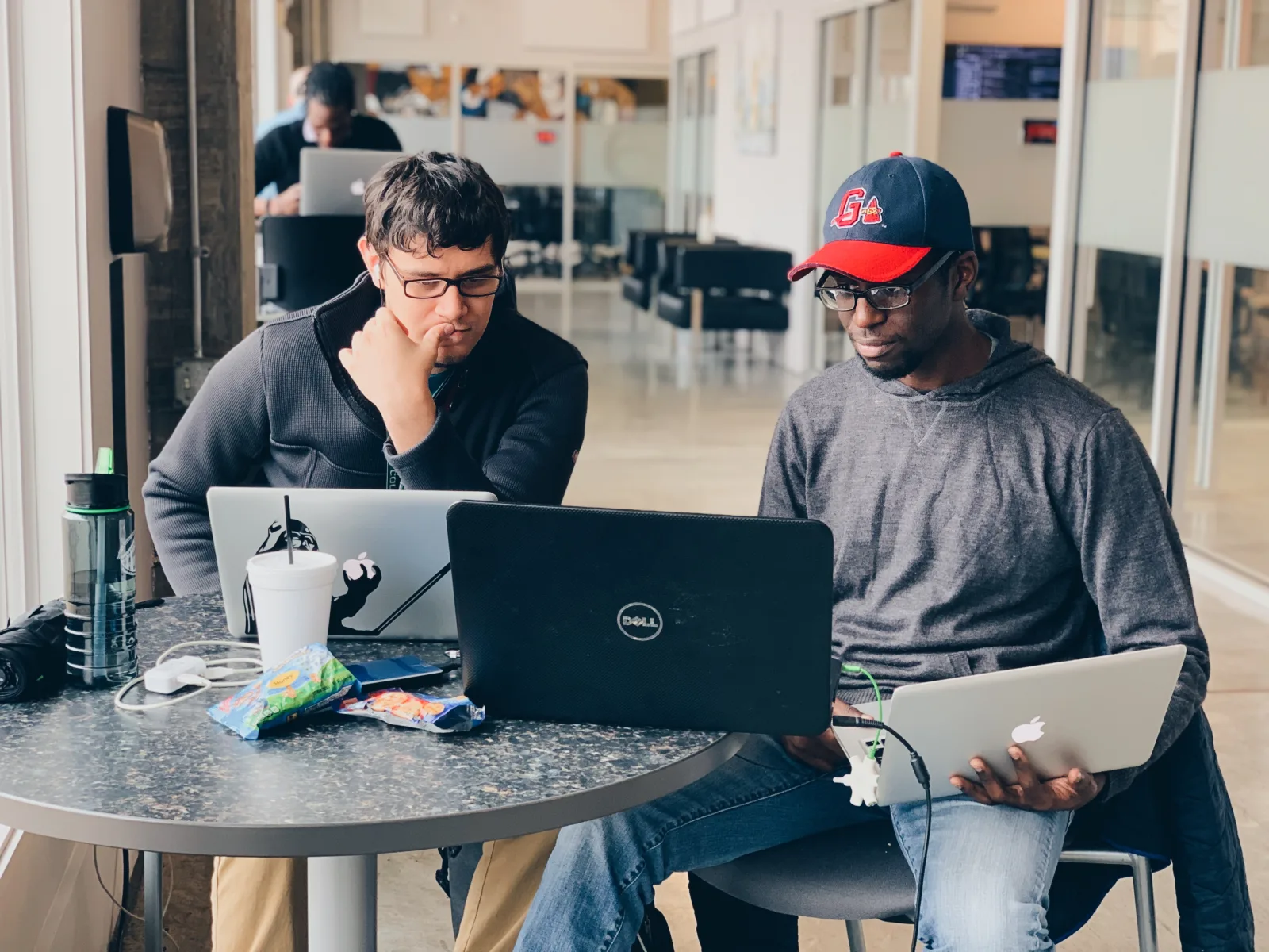 Members working on laptops